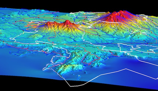 Contour map of region around the ACG, with legal boundaries of ACG outlined in white (including in the Pacific Ocean). Can see the flat lowlands, river courses, and the volcanos protruding upward in apparent 3-D.